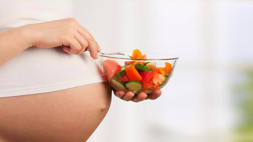 Nutrition During Pregnancy - Pregnant woman with fresh vegetables